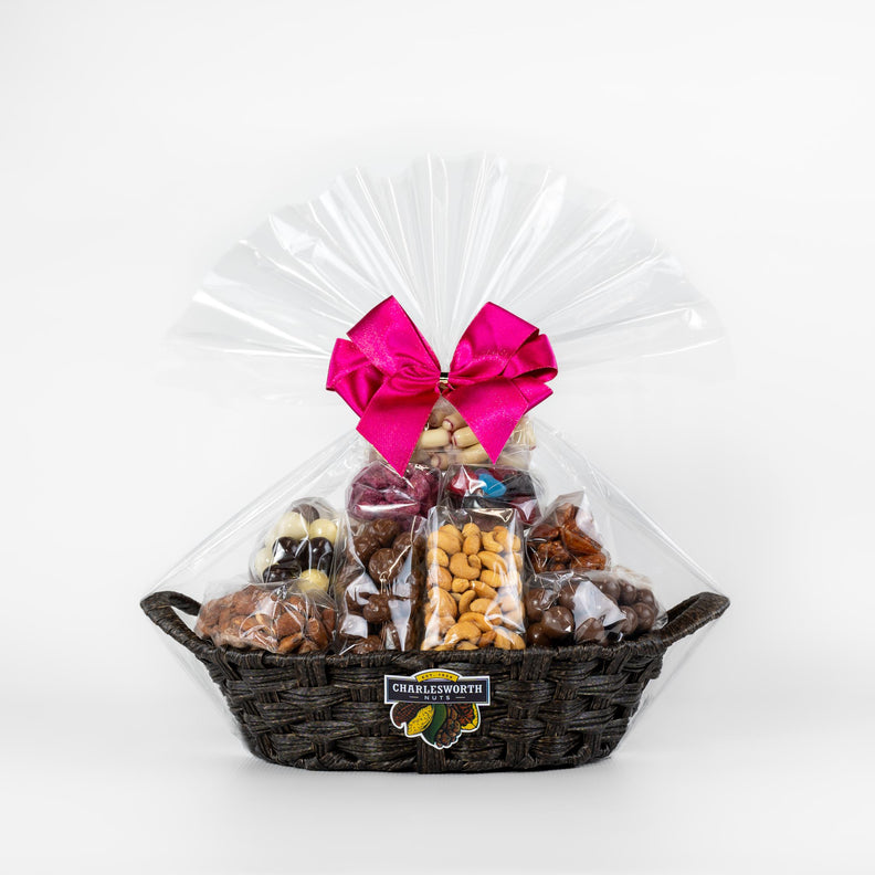 A black gift basket filled with Charlesworth nuts and chocolates, perfect for Mother's Day.