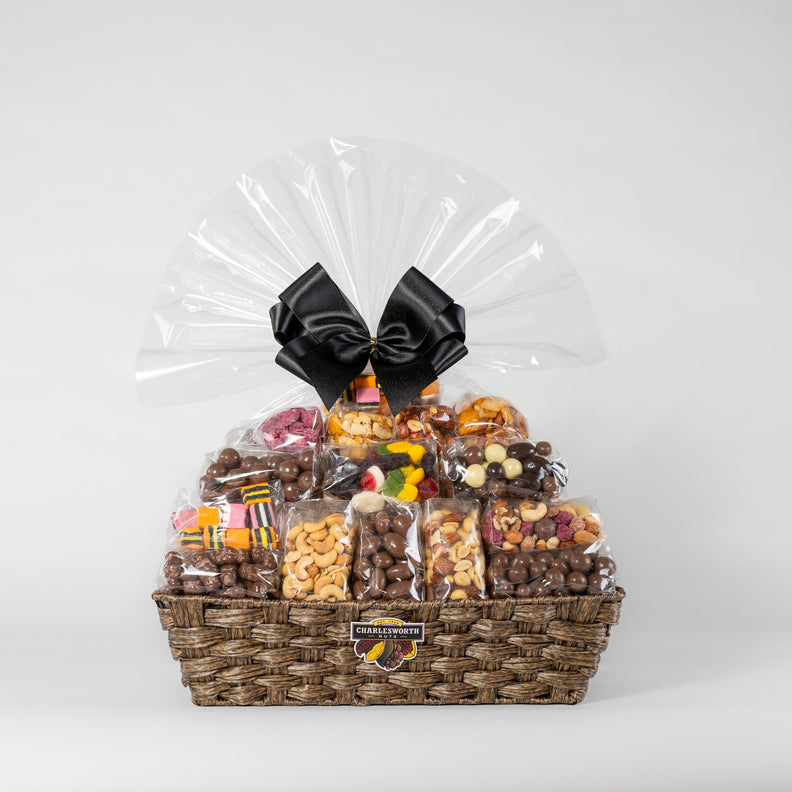 Large gift basket, elegantly tied with a luxurious black ribbon, filled with 33 irresistible Charlesworth nuts and chocolates.