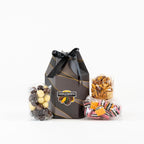 "Small gift box filled with rice cracker mix, chocolates and licorice."