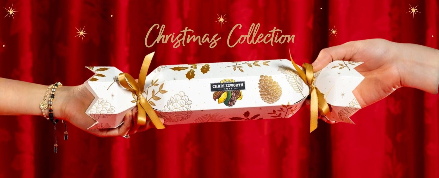 Two hands holding Christmas-themed gift boxes against a red background with 'Christmas Collection' text.