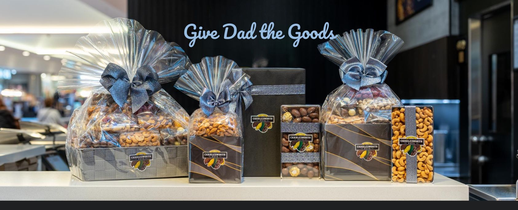 "Fathers Day Gift baskets and boxes with 'Give Dad the Goods' text."