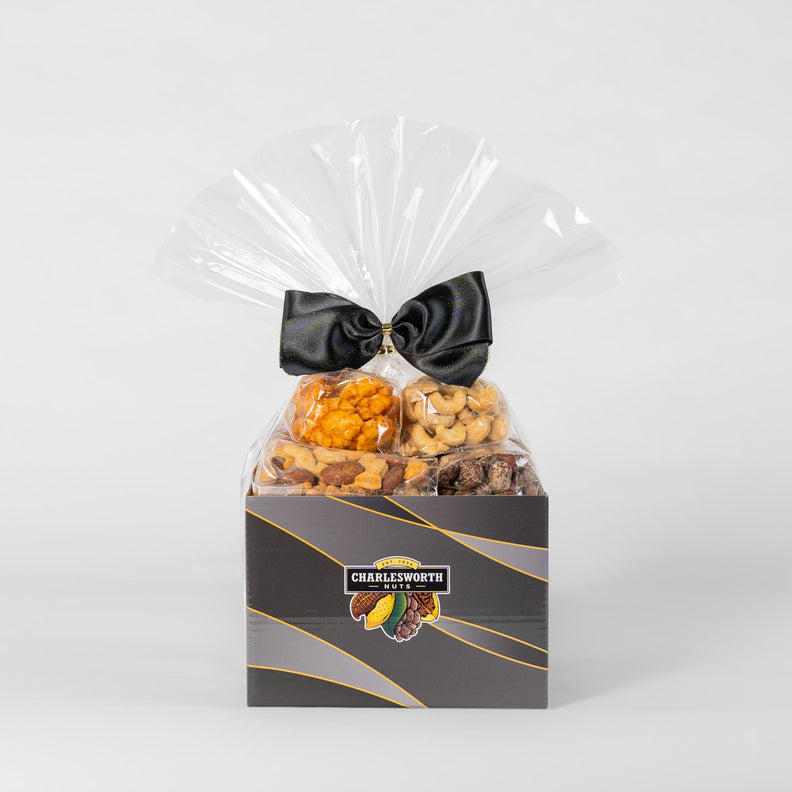Gift Basket with black ribbon filled with a delicious assortment including Beer Nuts, BBQ Crackers, Salted Cashews, and Smoked Almonds.