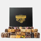 "Luxury black gift box filled with nuts, crackers, lollies and chocolates."