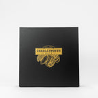 "Corporate black gift box filled with delicious nuts and chocolates."