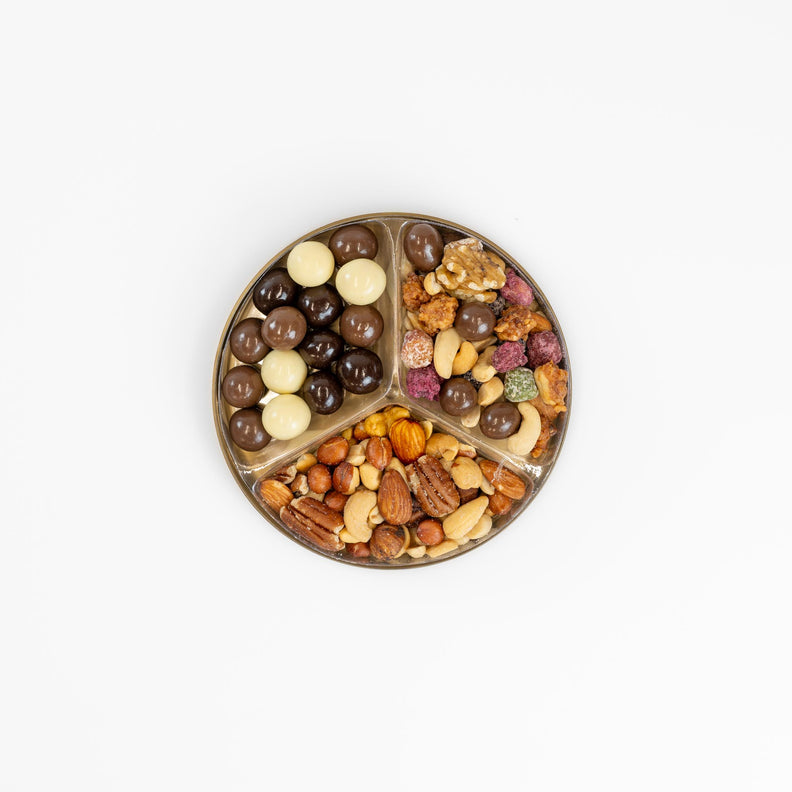 Christmas gift pack filled with salted nuts, chocolates, and sweet treats. 