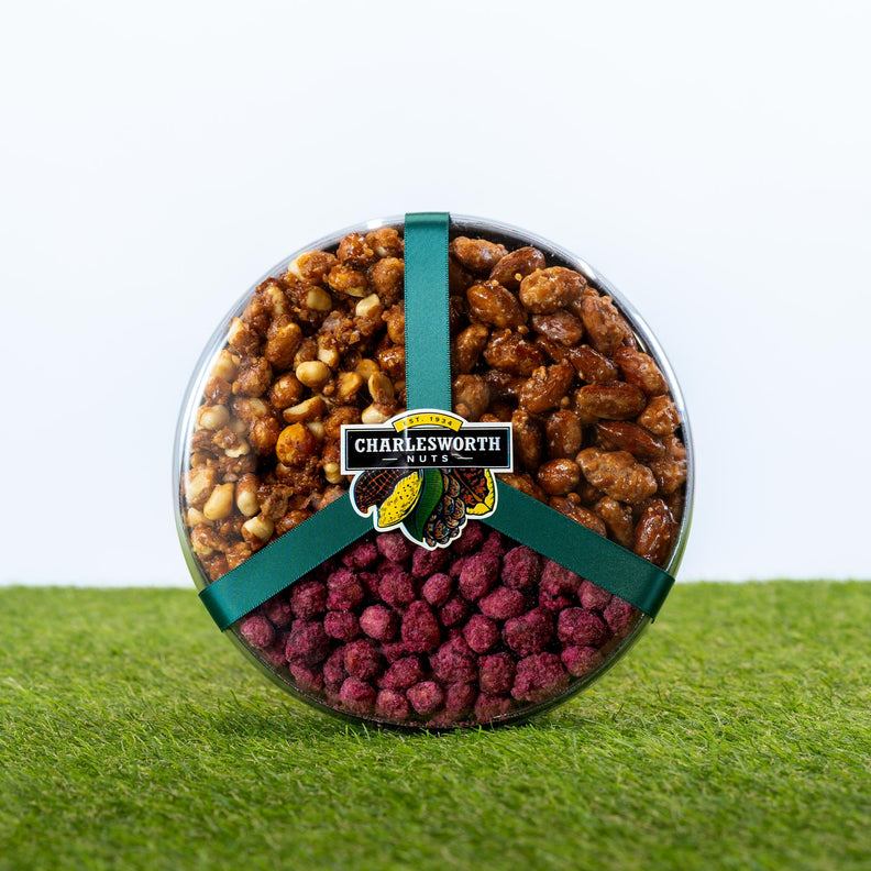 Father's Day gift packed with glazed almonds, glazed peanuts and sugared peanuts in a round clear container tied with a dark green satin ribbon.