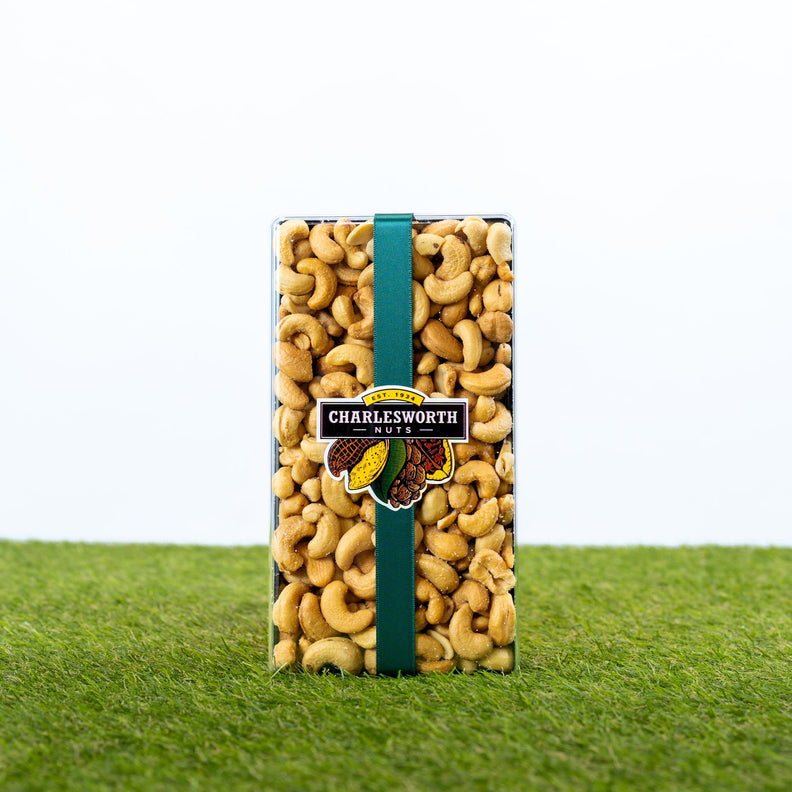 Father's Day gift box packed with premium cashews tied with a dark green satin bow.