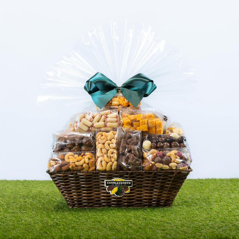 Charlesworth Nuts The Best For The Best Father's Day gift hamper, large wicker basket overflowing with 22 nuts, chocolates and treats, wrapped in clear cellophane with a green satin bow